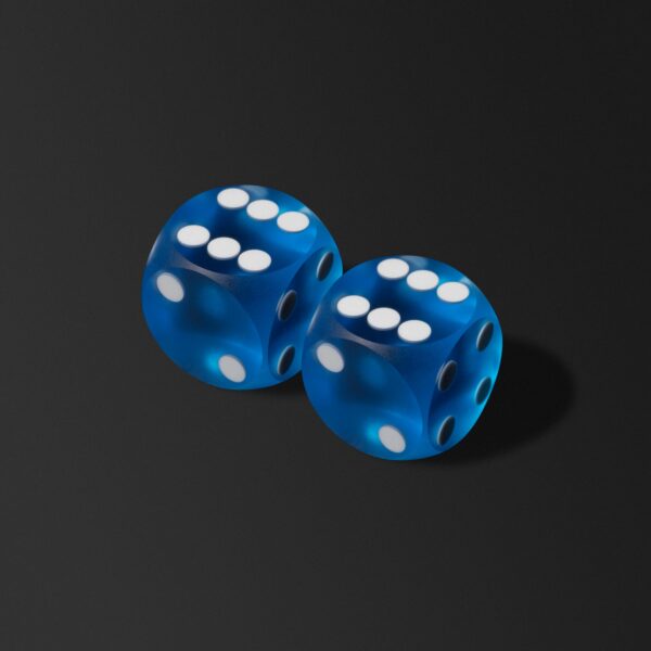 Two blue dice with white dots on a black background